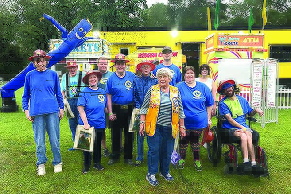 Members of the Ellijay Lions Special Friends enjoy an outing to the Gilmer County Fair with Lion Jane Weaver, front.