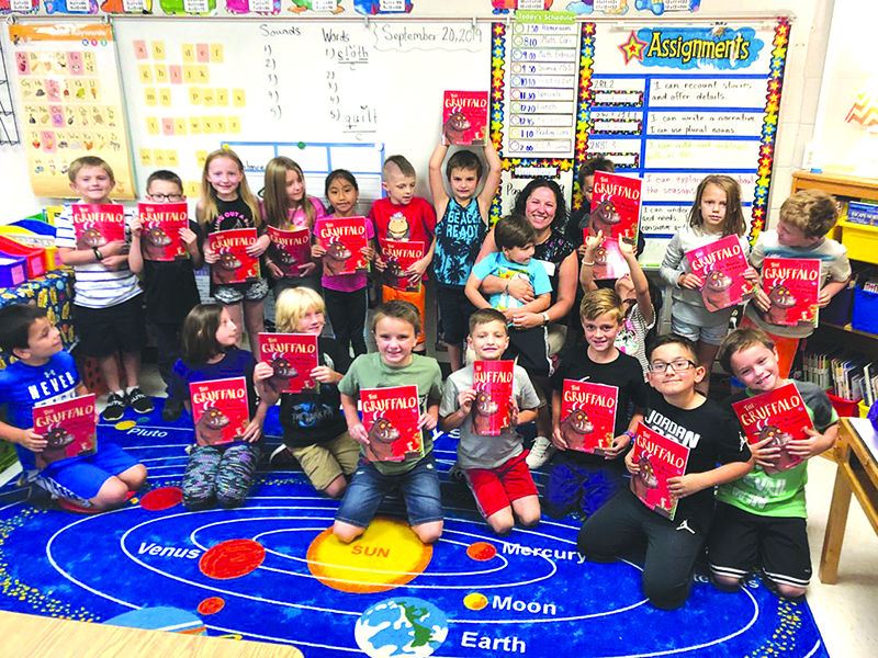 Ms. Trelley’s second-grade class volunteer reader was Chyrl Schlenke who gifted the class with a copy of The Gruffalo.