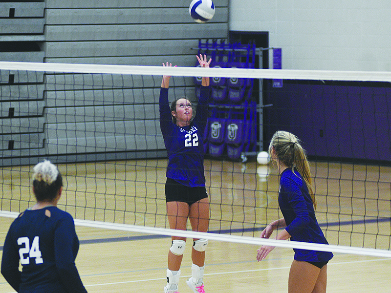 Gilmer senior Josie Reece (22) sets the ball for teammate Elly Callihan at the Lady Cats’ final home match.