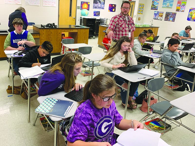 Clear Creek Middle School students in Les McDaniel’s sixth-grade science class make use of their Chromebooks during Monday’s lesson.