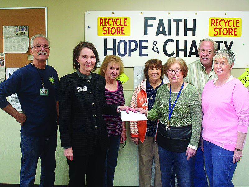 Gilmer Family Connection Director Merle Howell Naylor, second from left, accepts a donation check for the nonprofit’s Christmas Campaign from Faith, Hope and Charity Recycle Store representatives Jerry Below, Rita Odom, Bonnie Greene, Marcia Phillips, John Hamrick and Edith Warren.