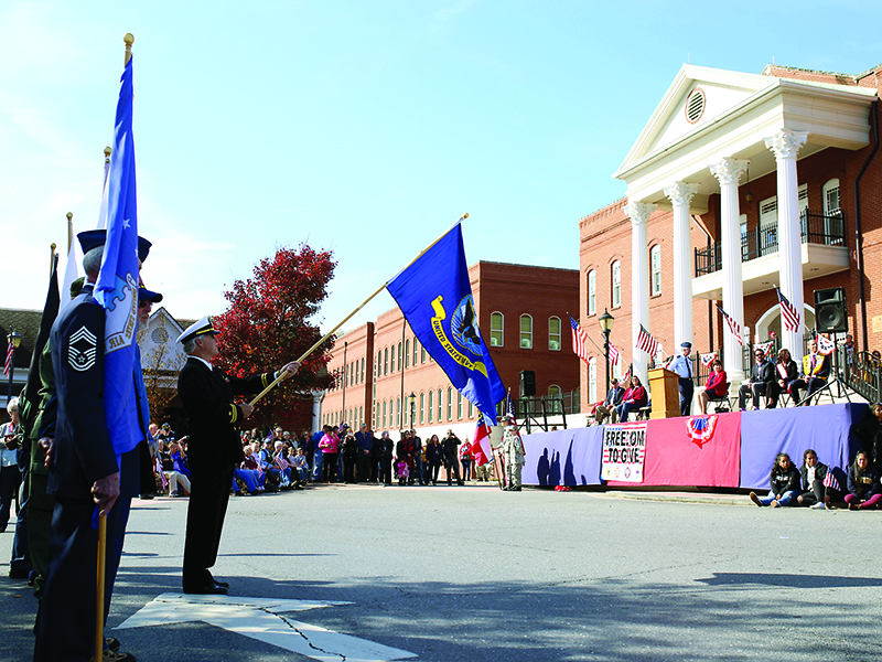 Different branches of the military display their respective flags during the downtown Veterans Day celebration Monday, Nov. 11.  (Photo by Caitlin Neal)