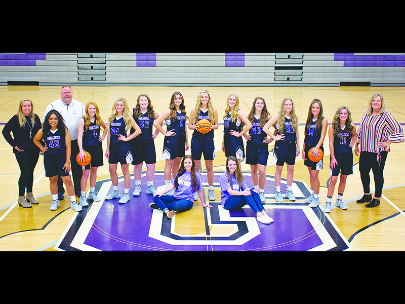 Above are Gilmer High’s varsity Lady Cat basketball players, coaches and managers. Front row, are managers Brooklyn Bowen and Kylie McCook. Middle row, from left are players Jasmine Staley, Hope Colwell, Emma Callihan, Jalynn Ledford, Anne Elise Williams, Elly Callihan, Lark Reece, Emma Deyton, Bailey Teague, Reagan Boling and Beth Burnette. Back row, are coaches Ashley Waters, Scott Kiser and Susan Nunn.