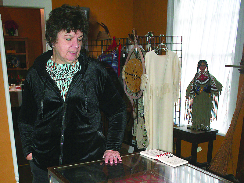 Leslie Thomas, president of the Gilmer Historical Society and a past president of the Georgia Trail of Tears Association, shows some of the artifacts on display at the historical society’s Tabor House Museum in downtown Ellijay.