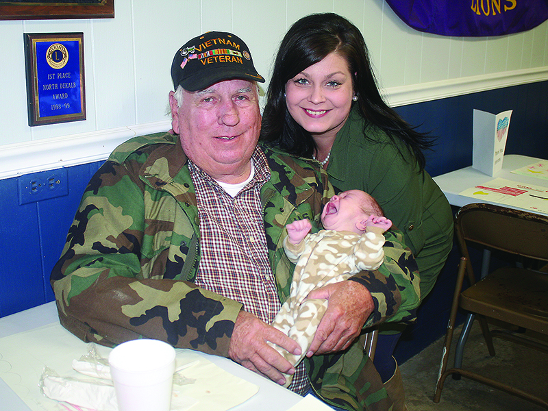 Jim Findley enjoys lunch with his granddaughter, Hannah Wyman, and sleepy great-grandbaby, Coda Wyman.
