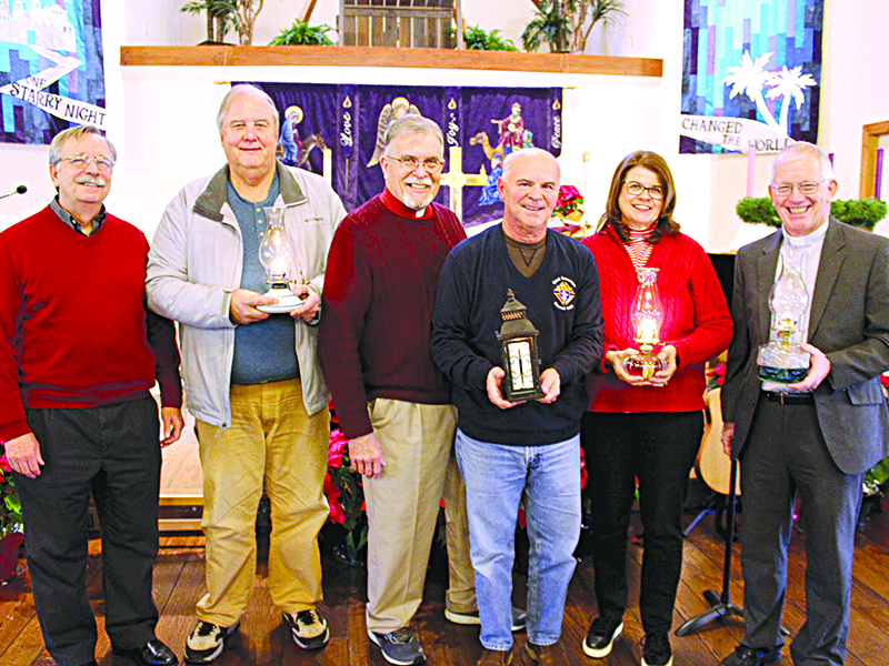 Pastors and other leaders involved in the Bethlehem Peace Light service Saturday at Hope Lutheran Church of Ellijay were, from left, the Rev. Thom Shores and Dean Carlsen of Ellijay First United Methodist Church, the Rev. David Smedley of Hope Lutheran, Jack Planchard of Good Samaritan Catholic Church of Ellijay, Marcia Rubin of King of Kings Lutheran Church in Jasper and Pastor Jim Kroninger of Shepherd of the Hills Lutheran Church in Morganton.