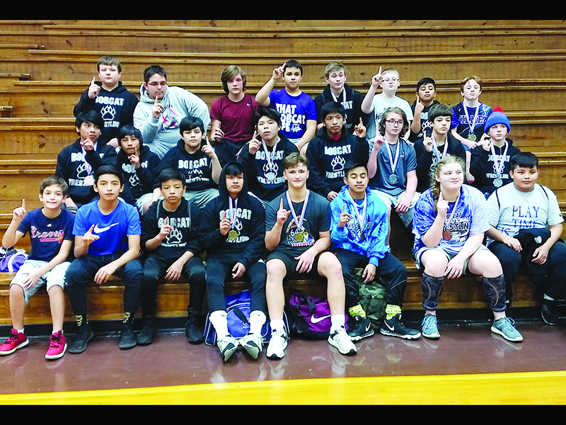 Above are Clear Creek wrestlers after winning the Mountain League’s traditional wrestling title last Saturday. A day prior, the CCMS also won the league duals championship.