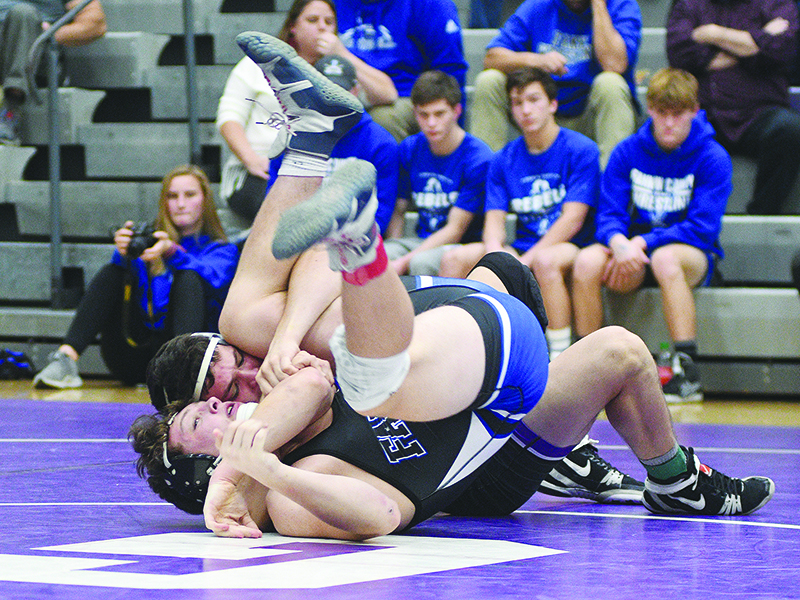 Gilmer senior Caleb Waddell locks his opponent into a cradle during a recent match and turned in a runner-up finish at the Bradley Central Invitational.