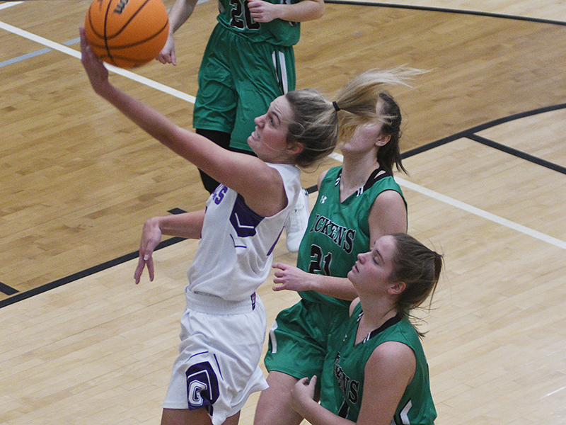 Gilmer’s Emma Callihan drives for two of her 18 points against Pickens.
