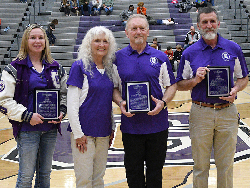Lucy and Rick Harris, center, accept the Gilmer Sports Hall of Fame plaque on behalf of their son, the late Noah Harris, and they are joined by fellow class of 2019 inductees Amanda Parker (left) and Mark Pettit (right).