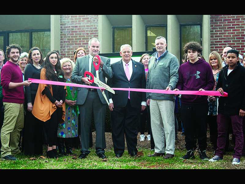 Site administrator Mike Putman cuts the ribbon in front of the new location of Mountain Education Charter High School (MECHS) inside the Larry Walker Education Center. Also pictured, in front from left: MECHS teacher Daniel Hayes, Georgia Charter Schools Foundation President Michele Nealy, MECHS Public Information Officer Sydney Sanford, MECHS Public Relations Coordinator April Smith, Putman, Georgia House Speaker David Ralston, MECHS Superintendent Dr. Wayne Lovell, student Evan Sanford and Carlos Reynoso.