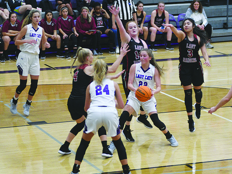 Gilmer senior Bailey Teague (22) draws a crowd versus Southeast Whitfield before passing to Emma Callihan (24) for two points.