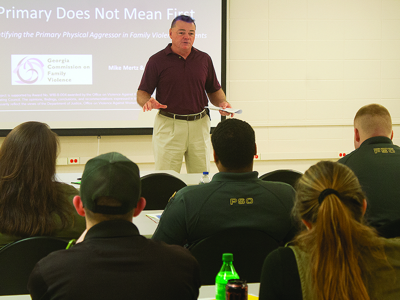 Mike Mertz, of the Bibb County Sheriff’s Office, above, and B. Morris Martin, assistant district attorney for the Appalachian Judicial Circuit, below, talk to police officers from various counties during a training course that focused on responding to domestic and family violence incidents.