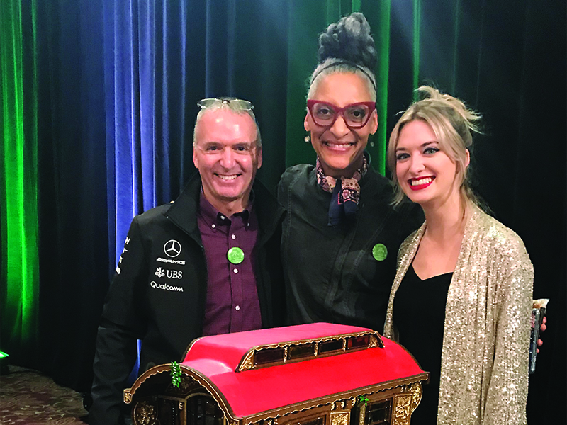 Julia Vorpahl, a 2014 Gilmer High School grad, right, and her dad, Larry, are joined by Food Network personality and professional chef Carla Hall, center, at the 2019 National Gingerbread House Competition in Asheville, N.C. 