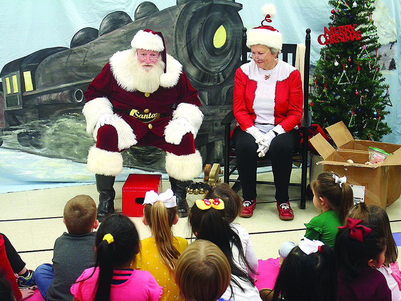 Santa and Mrs. Claus tell stories and greet children at CCES.