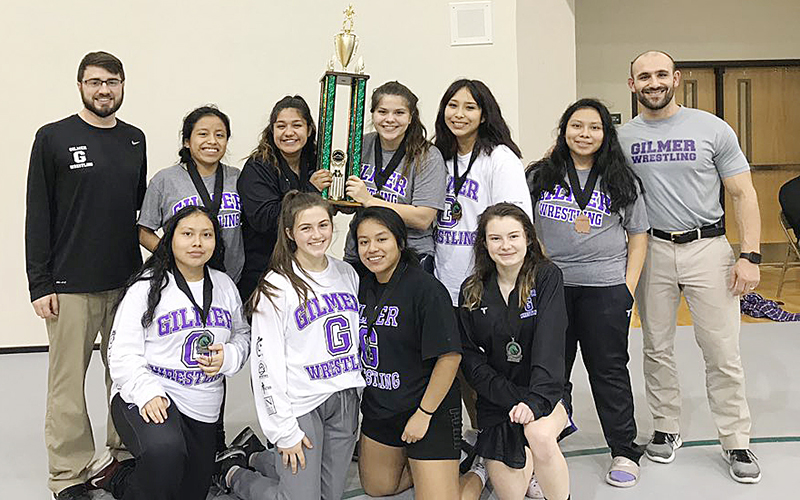 Above are wrestlers and coaches after Gilmer’s female wrestlers won their portion of the Burnt Mountain Classic last Saturday. Front row, from left are Marisol Perez-Lopez, Anna Waddell, Francisca Lopez and Vallery Wofford. Back row, are coach Scott DeGraff, Laura Tercero, Karina Gonzalez, Claudia Zilke, Noemi Torres, Maribel Perez-Lopez and coach Josh Ghobadpoor. Not pictured, Sierra Ellis.