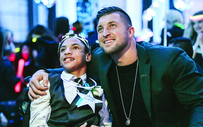 Through his nonprofit outreach foundation, professional athlete Tim Tebow, right, is the driving force behind the annual Night to Shine. This year, the prom event for children and adults with special needs will be hosted internationally by 800 churches, one of which is Cartecay Baptist Church in Ellijay.