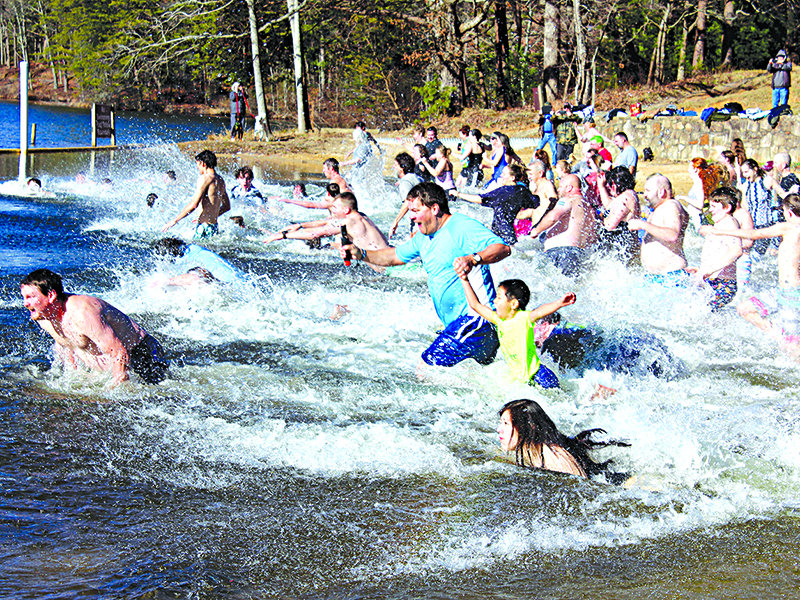 Black Bear Plunge participants hit the lake at Fort Mountain State Park New Year’s Day. Air temperature was around 35, and the water was 52 degrees, a ranger announced.