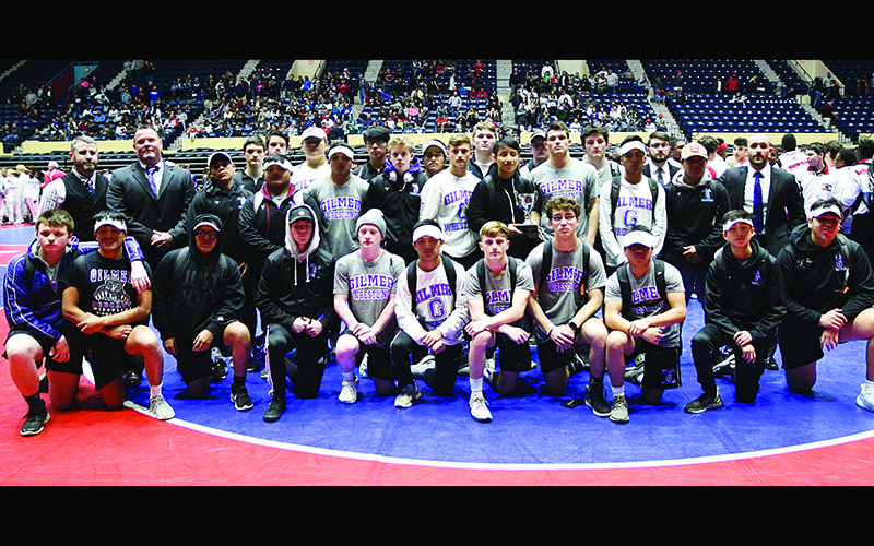 Above are Gilmer High School wrestlers and coaches following the Bobcats’ second-place finish in the Class 4A state duals.