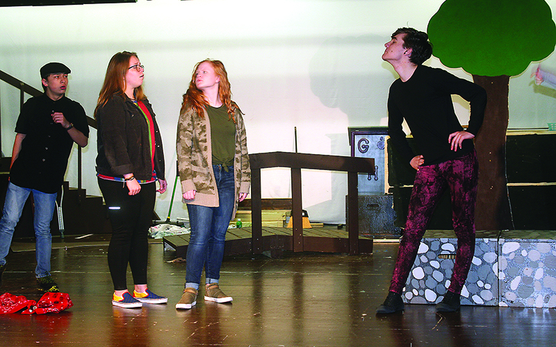 From left, Raegan Dempsey, as Winnie the Pooh, and Sophie Burnette, as Piglet, meet Tigger, Nick Jones, during a rehearsal for the upcoming GHS Theatre production of The House at Pooh Corner.