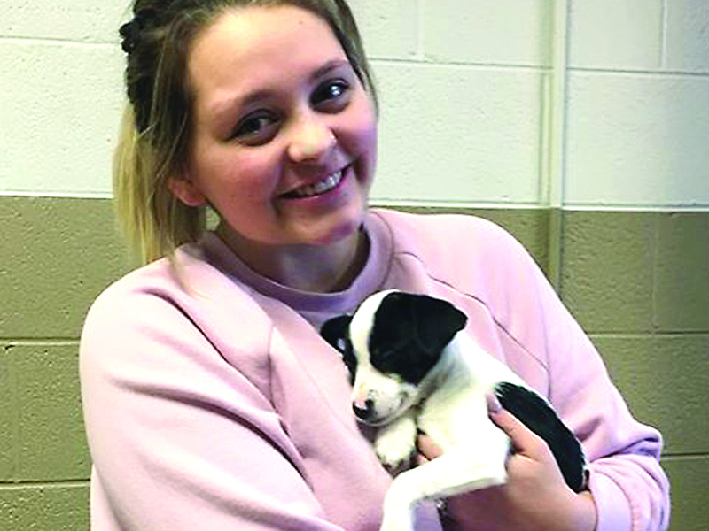 Heidi Wimpey with her puppy, Ellie May, at a recent spay/neuter clinic presented by Friends of the Gilmer Animal Shelter (FOGAS) at the Gilmer Civic Center. 
