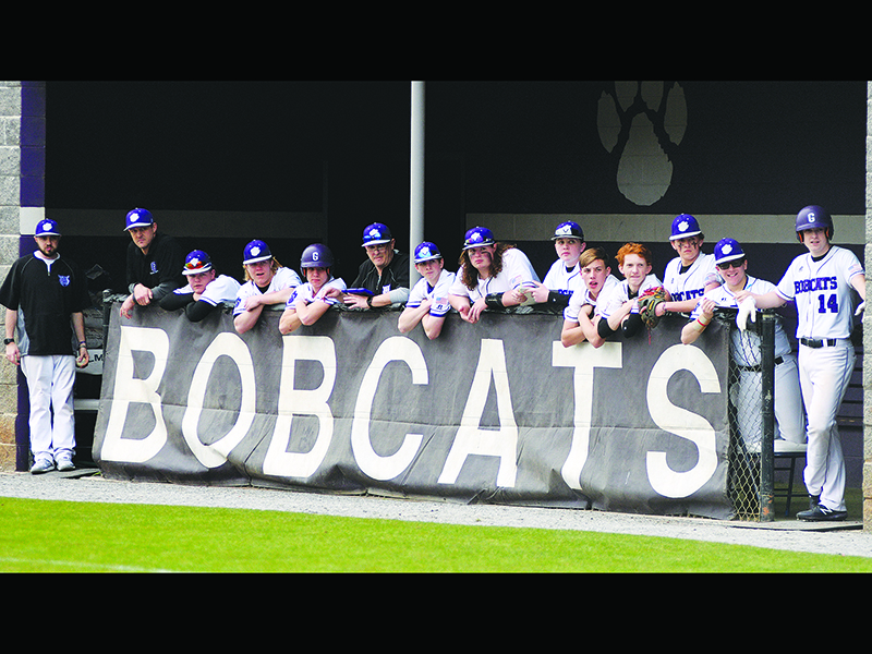 The Bobcat bench looks on during a Gilmer at-bat earlier this season. The GHS varsity has posted a 2-4 record and has three more games scheduled for this week.