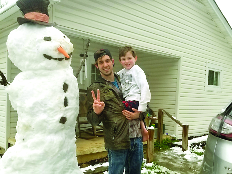 Nick and Liam Fredrickson built this towering 7 ft. snowman during the snowfall Saturday.