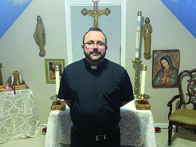 Father Carlos Vargas, of Ellijay Good Samaritan Catholic Church, is pictured above at a small chapel he built inside his home. Vargas has been using the chapel to lead a daily mass in English and Spanish, which is live-streamed on the church’s Facebook page. 