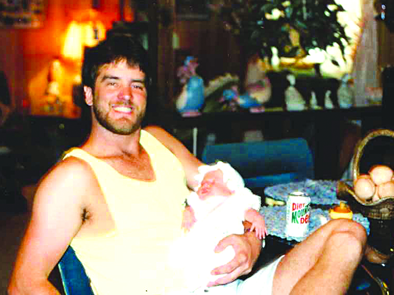 Dale holds daughter, Whitney.