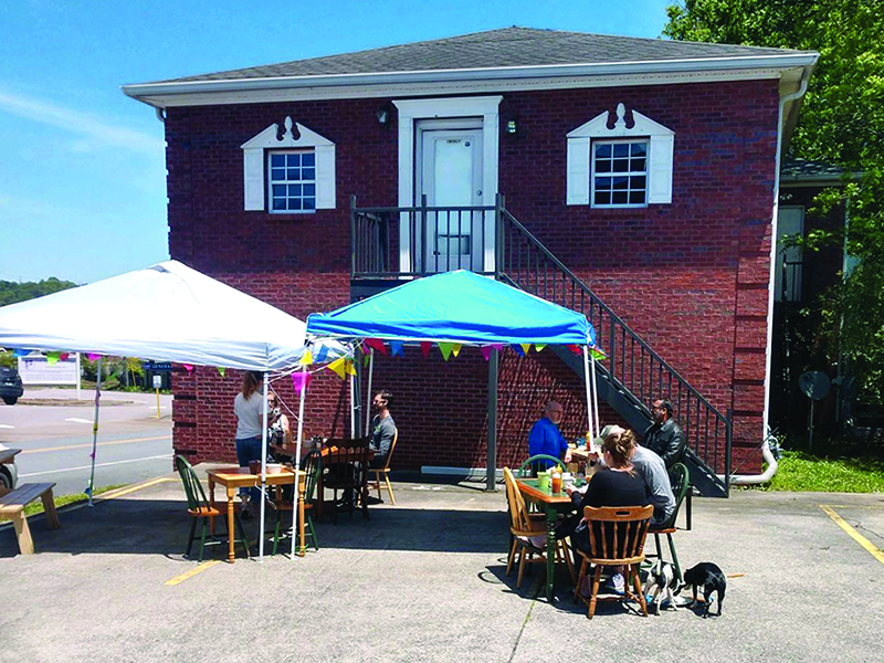 An outdoor dining area has been used to accommodate Cornerstone Cafe customers after the downtown Ellijay restaurant recently reopened.