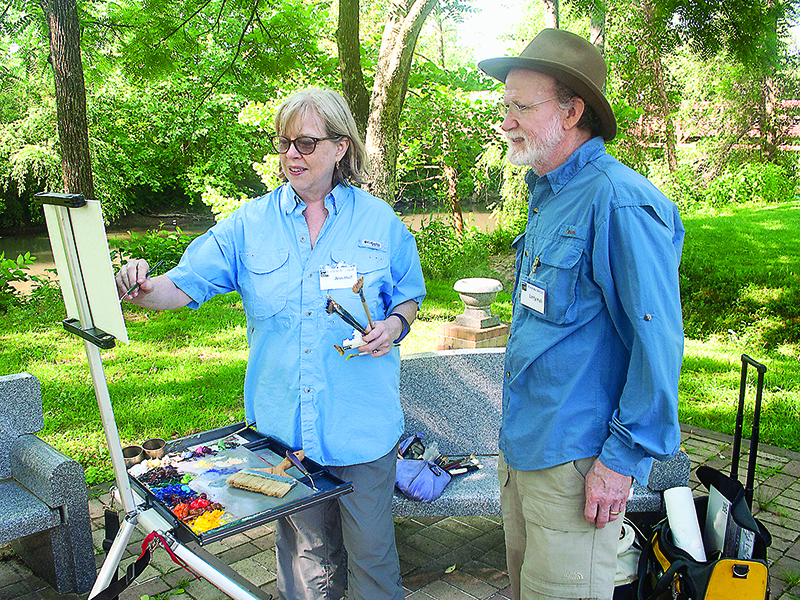 Artists Ann & Larry Hall participate in a past plein air outdoor painting weekend presented by Gilmer Arts and the Gilmer Chamber. That three-day event, originally scheduled for June 5-7, will take place in September this year.