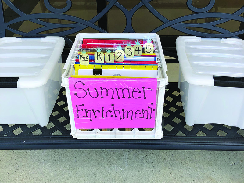 Pictured are free books and optional summer enrichment activities at the front entrances of Gilmer County Schools. Activities were constructed to be fun and engaging and keep students’ academic skills sharp over summer break.