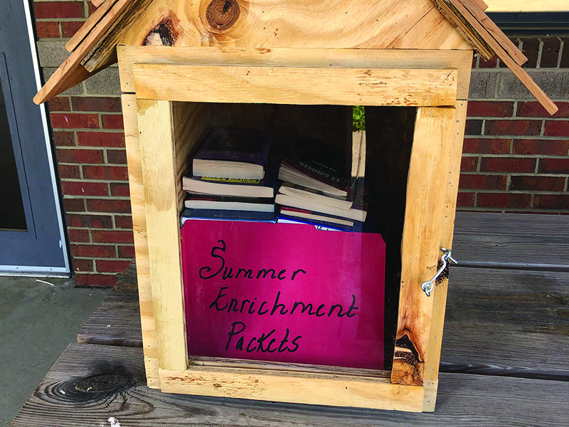 Pictured are free books and optional summer enrichment activities at the front entrances of Gilmer County Schools. Activities were constructed to be fun and engaging and keep students’ academic skills sharp over summer break.