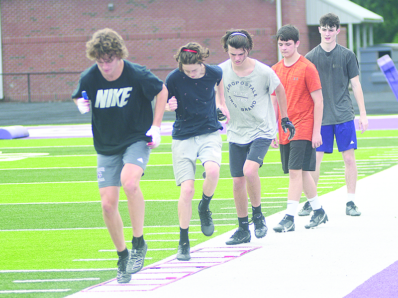 Gilmer High School football players focus on improving their footwork last Wednesday. All GHS athletes are off this week during the Georgia High School Association’s mandated dead week before conditioning resumes next Monday.