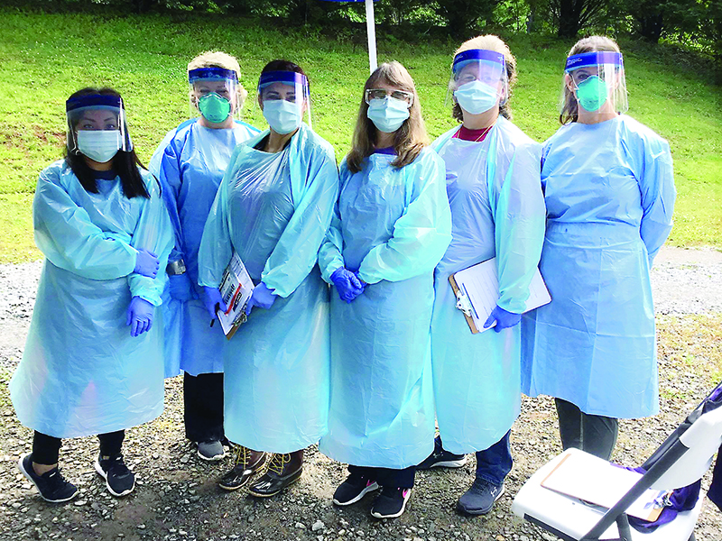Public health staff members from the Gilmer County Health Department are pictured in protective gear worn while working at the local COVID-19 testing site. Pictured, from left, are Nohemi Reynoso, Leigh Ann Dover, Irene Rosales, Trina Matthews, Monica Ledford and Krystal Sumner.
