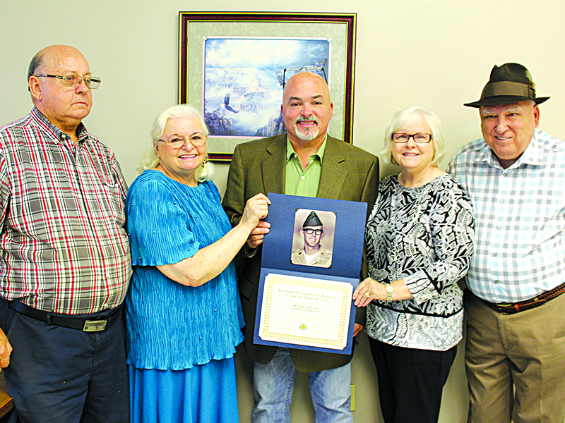 Family members of U.S. Army PFC William Charles Burgess Jr., killed in Vietnam on June 4, 1969, gathered last year to see him honored as the Vietnam Veterans of America, Cumming Chapter 1030, presented a high school scholarship in his honor. The date of the presentation was exactly 50 years from the day Burgess was killed. From left are cousin Wayne McPherson, sister Elizabeth Minton-Mooney, nephew Steve Minton, sister Evelyn Morace and Raymond Morace.