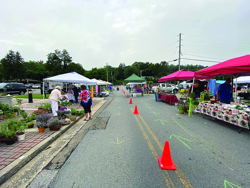 Above, a new one-way aisle layout has been adopted at the Ellijay Farmer’s Market.