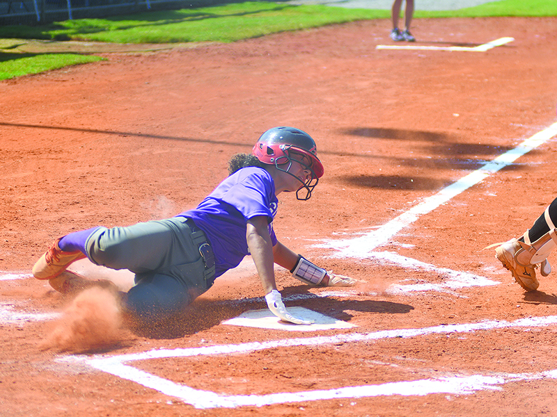Gilmer High sophomore Maddie Wright slides safely home to give the Lady Cats the lead against Sonoraville last Saturday.