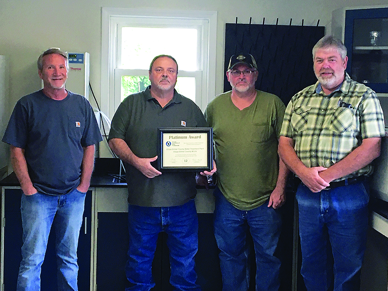 Employees of the Cartecay Water Treatment Plant show the Platinum Award the plant recently received from the Georgia Association of Water Professionals. Pictured, from left, are: Dale Stanley (assistant superintendent), Gary Nix (plant superintendent), Dwight Pratt (operator) and Todd Dilbeck (lab analyst/operator).