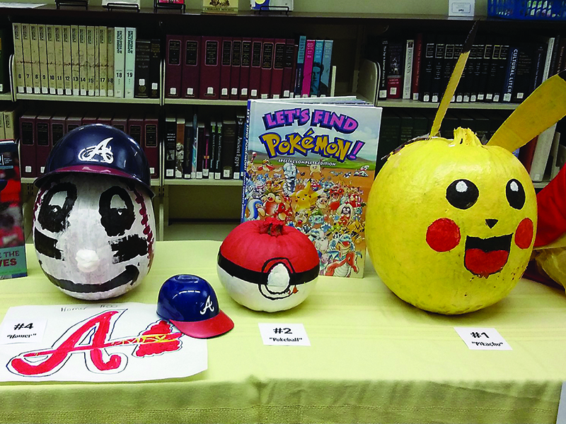 Pictured are some of the creative entries in last year’s Pumpkin Palooza at the Gilmer County Library. This year, the pumpkin decorating contest will be held online with entrants submitting photos of their work.