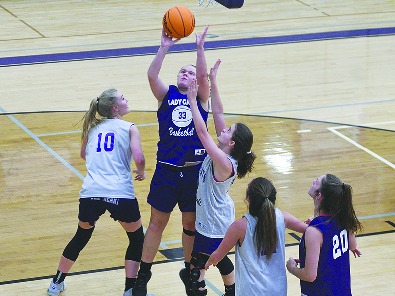 Lucy Ray scores two points in the post for Purple during last week’s scrimmage.