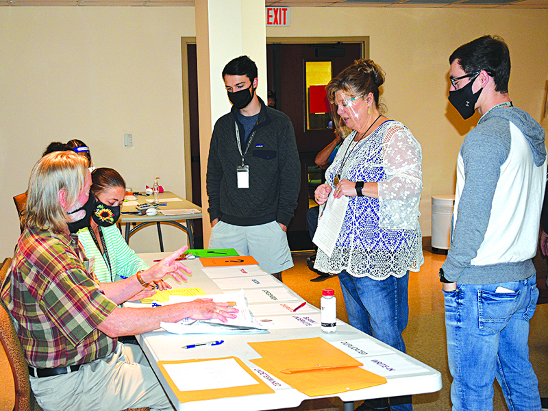 Chief Registrar, Tammy Watkins, discusses count procedure with Joe Strickland and Amanda Keith during the by-hand recount Friday, Nov. 13. Also pictured, Austin Watkins (far right) and Jacob Brooks.