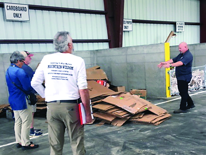 From left, Robert Ferguson, Gilmer Post 2 Commissioner Karleen Ferguson and Jay Zipperman, of Keep Gilmer Beautiful, learn more about the newly-opened Pickens County Recycling Center from Pickens Waste and Recycling Director Kenny Woodard, right.