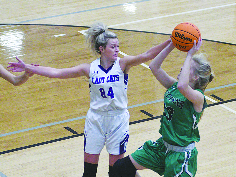 Lady Cat senior Emma Callihan defends a shot and scored 19 points in Gilmer’s region opener versus West Hall last Tuesday.