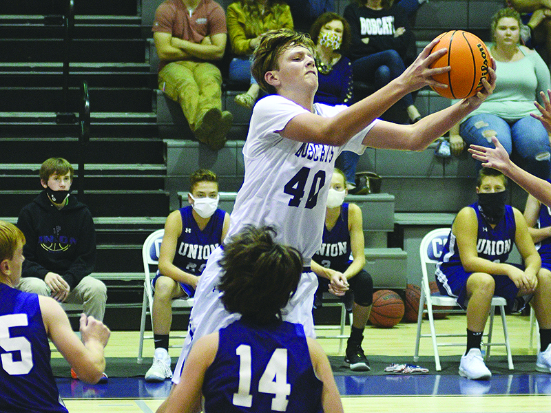 Eighth grader Jackson McVey collects an offensive rebound for the CCMS Bobcats, and he scored 23 points versus White County last Thursday.