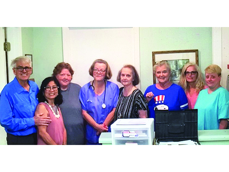 Dr. Robert Bond is pictured, at left, with his wife and office manager, Cory Bond, second from left, and Blue Ridge Mountain Internal Medicine staff members Teresa Newsome, Barbara Parks, Dianne Hughes, Rebecca Martin, Sherry Pierce and Lisa Hughes.