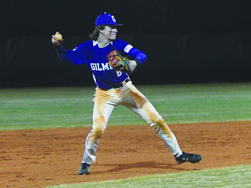 Gilmer junior third baseman Spencer Merritt throws to first and collected nine hits, five RBIs and scored six runs over a four-game span last week.