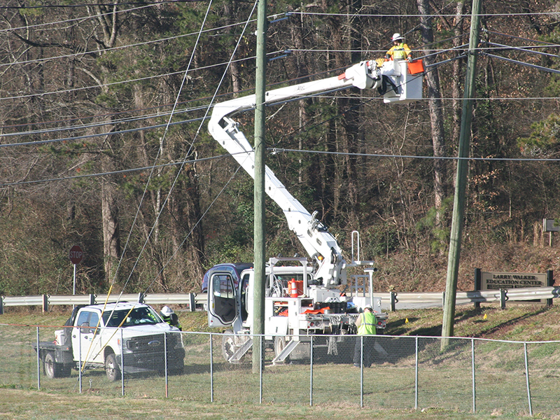 A crew is pictured working along South Main Street, part of the work area for an ongoing Georgia Power Grid Investment project that involves undergrounding and strengthening overhead power lines.  