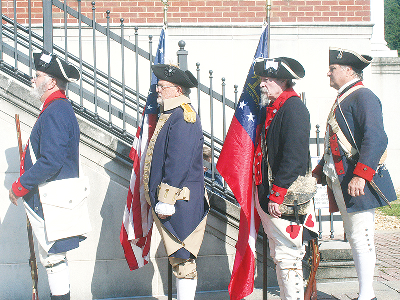 A color guard comprised of members of the Sons of the American Revolution Blue Ridge Mountains Chapter stands at ready during the dedication event. Pictured, from left: Stephen Weaver, Jared Ogden, Sid Turner and Mike Sutila. 
