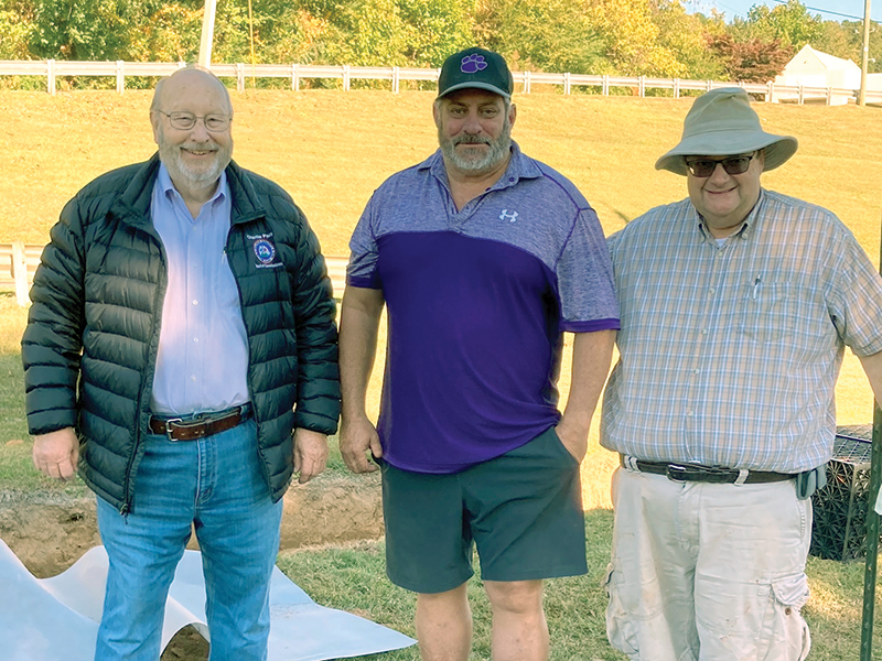 From left, Gilmer County Commission Chairman Charlie Paris, Gilmer Parks and Rec. Director Kevan White and Ricky Ensley, of the Georgia Soil and Water Conservation Commission, are pictured next to one of the collection boxes being installed in a new storm water management system at River Park.   